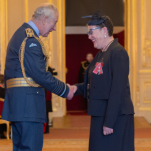 King Charles III presents Duke faculty Terrie Moffitt with the title "Member of the Most Excellent Order of the British Empire" on December 19, 2023. 