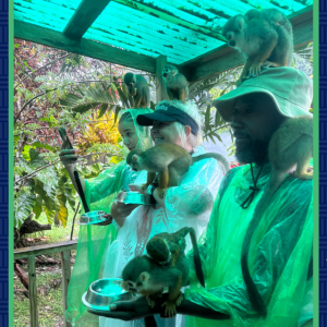 Zarrin (center), her daughter Timia (left), and her husband Tim (right) at a monkey sanctuary during feeding time in the Dominican Republic in October 2024.