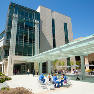 Trent Semans Center with view of patio, people sitting at a table.