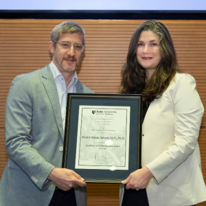 Jonathan Posner presents award to R. Alison Adcock